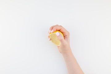 Fototapeta premium Woman hand with lemon