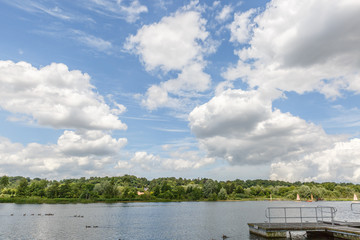Beautiful landscape that includes the view of a river, one of its banks and a blue sky