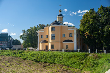 Fototapeta na wymiar Ancient Russian church, blue sky, golden domes.