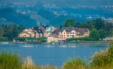 Naklejka premium The ancient village of Hurden, located in a small peninsula at the narrowest point of the upper Zurich Lake (Obersee), Schwyz, Switzerland