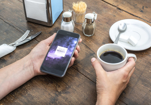 Smartphone User Holding Coffee Cup Mockup