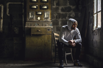 Man sitting alone in dark room