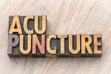Fototapeta premium acupuncture word abstract in wood type