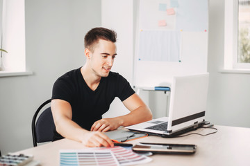 Graphic designer working with color palettes and graphic tablet in studio. Design, innovations, creative projects. Digital art, developing, media concept