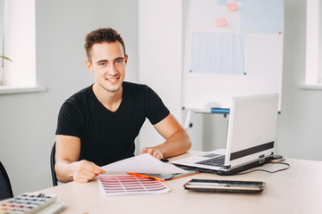 Young creative specialist working with color palettes. Designer at workplace. Design studio, creative projects. Digital art, developing concept