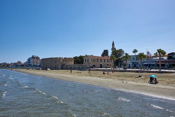 Naklejka premium Cyprus. Larnaca. Beach bridge. View of the Castle - a medieval Ottoman fortress