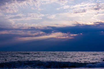 Amazing sea sunset, the sun, waves, clouds