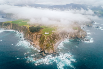 Aerial view of a lighthouse on a cliff