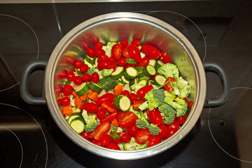Vegetable soup ingredients in pot