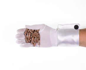 hand with medicinal pills on a white background