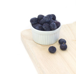 White bowl of blueberries