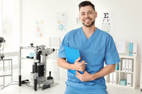 Portrait of smiling ophthalmologist in clinic