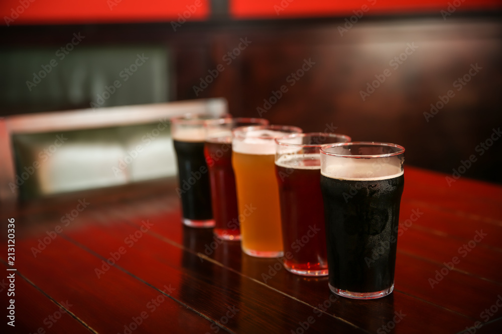 Canvas Prints Glasses of different beer on table indoors