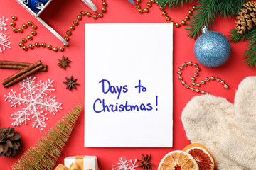 Paper and different decor on color background, top view. Christmas countdown