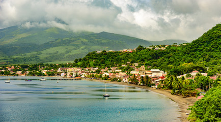 Fototapeta premium Paradise coast at Saint Pierre with Mt. Pelee, active volcanic mountain in Martinique, Caribbean Sea