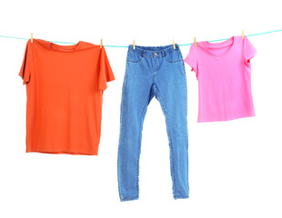 Clothes on laundry line against white background