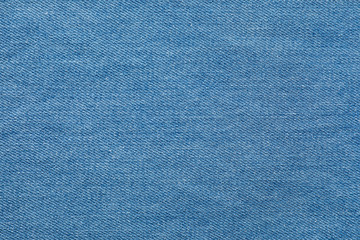 Fototapeta na wymiar Texture of blue jeans as background