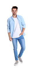 Young man in stylish jeans on white background