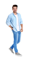 Young man in stylish jeans on white background