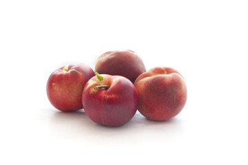 Ripe peaches on white background