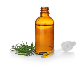 Bottle with rosemary oil on white background