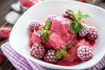 Delicious ice cream  made from fresh berries on a wooden background