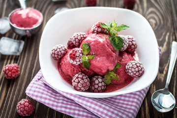 Delicious ice cream  made from fresh berries on a wooden background