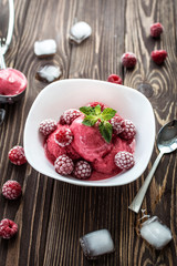 Delicious ice cream  made from fresh berries on a wooden background