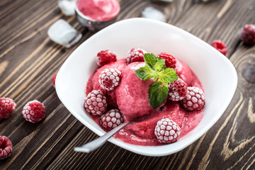 Delicious ice cream  made from fresh berries on a wooden background