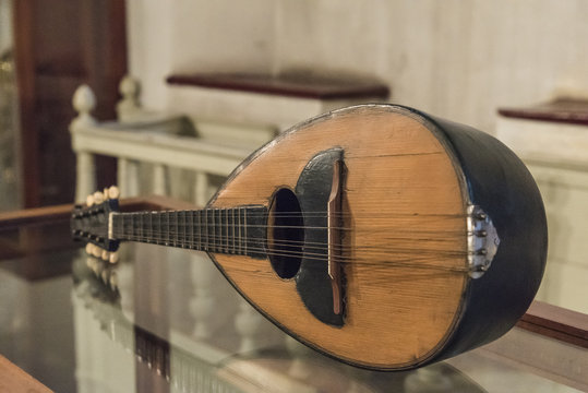 Focus on an ancient folk musical instrument, mandolin