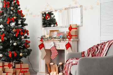 Stylish living room interior with decorated Christmas tree