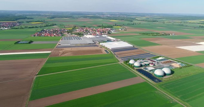 Aerial video of Biogas plant. The agricultural and greenhouse complex is equipped with its own biogas for the production of biogas, Europe