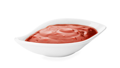 Gravy boat with spicy chili sauce on white background