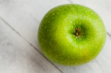 Green apple from upper view isolated  on a white background.