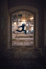 man jumping in front of a door