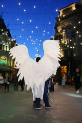 Man with white angel wings