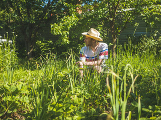 gardener working in the summer cottage yard during summer season