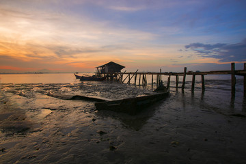 Beautiful sunrise view at fisherman jetty in Jelutong, Penang Malaysia. Nature composition.Visible Noise due to High ISO.