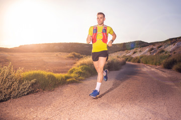 Young man running with greenish yellow shirt