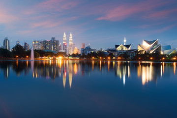 Fototapeta na wymiar Kuala Lumpur Cityscape. image of Kuala Lumpur, Malaysia during sunset at Titiwangsa park with fountain.