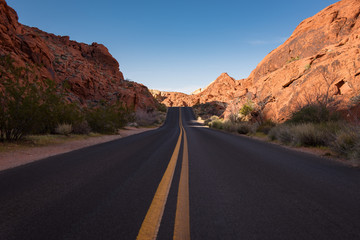 desert road highway with red rocks, nevada, utah