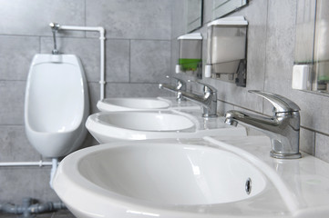 Public toilet. Washbasin. Water tap