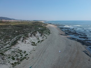 Fototapeta na wymiar Looking South at pebble beach in Belinho