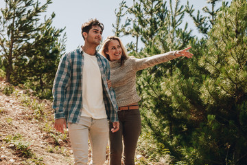 Couple looking at a view while hiking