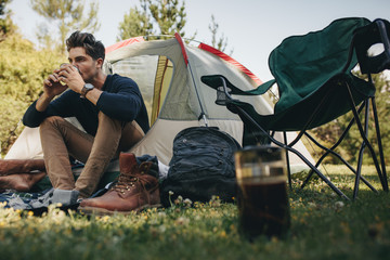 Man in tent drinking coffee © Jacob Lund