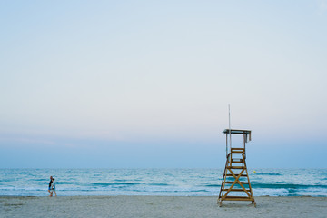 Fototapeta na wymiar Lifeguard watchtower on the beach at sunset.