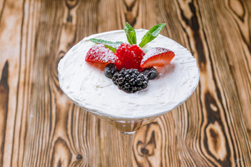 Glass with mascarpone and fresh berries