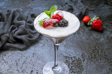 Glass with mascarpone and fresh berries