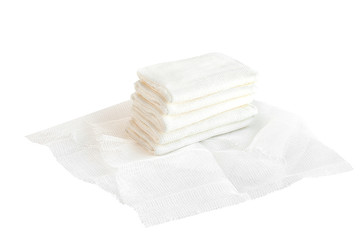Healthcare and equipment concept - medical tools. sterile cotton surgery gauze pads isolated on white background.