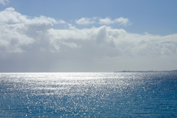 View on the sea and water sparkling on the sun